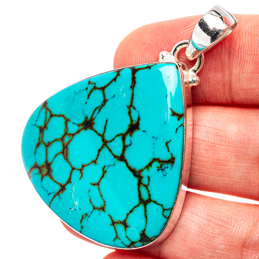 Turquoise teardrop pendant with crackle stone texture and silver bail on top