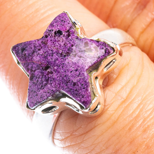 Star-shaped purple gemstone ring in .925 sterling silver on finger with silver prongs