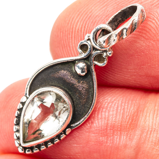 925 sterling silver pendant with oval clear stone, scalloped bezel, leaf motif top