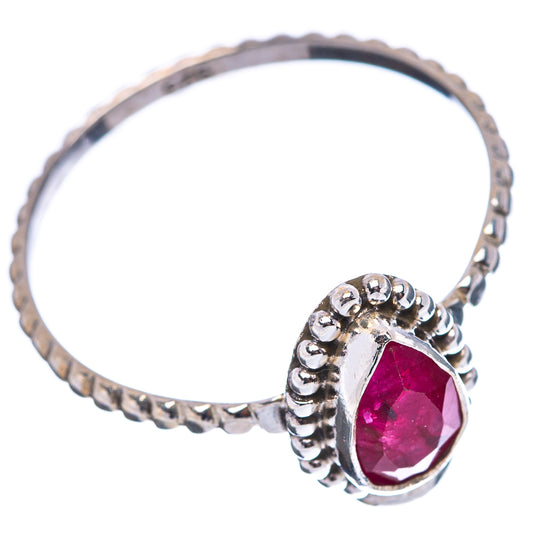 Sterling silver ring with red teardrop gemstone, split shank and beaded accents
