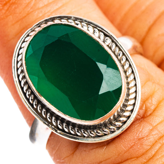 Green onyx oval ring with ornate sterling silver bezel and twisted band