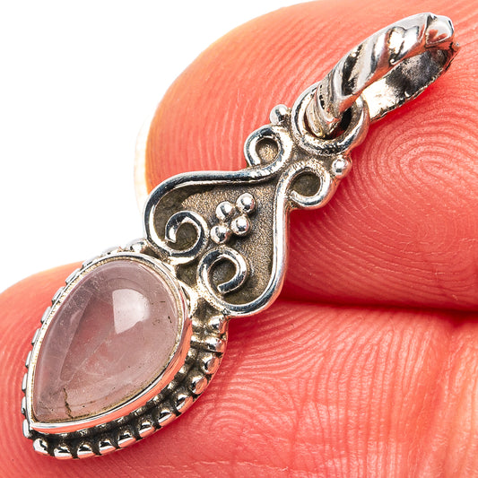 Dainty rose quartz pendant in .925 sterling silver, oval pink gemstone with ornate bezel.