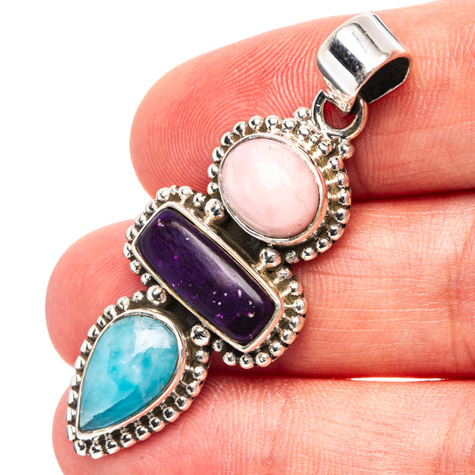 Sterling silver pendant with pink opal, sugilite, and larimar cabochons