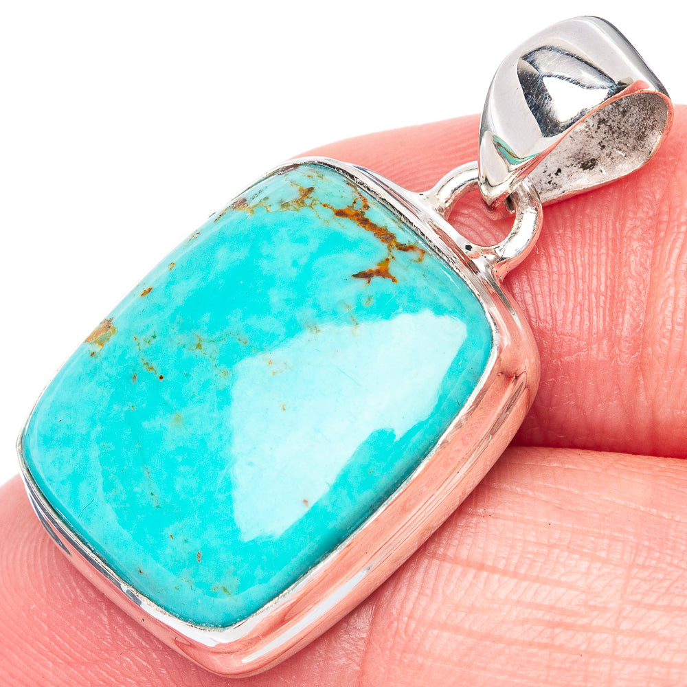 Turquoise pendant close-up with sterling silver frame, rectangular stone and bail