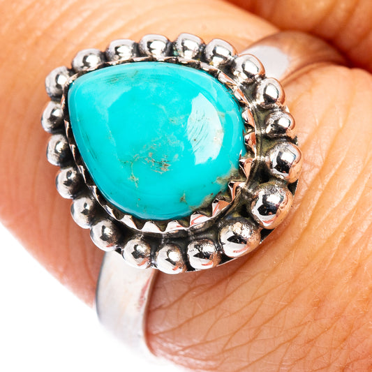 Sterling silver turquoise ring with oval cabochon and beaded bezel