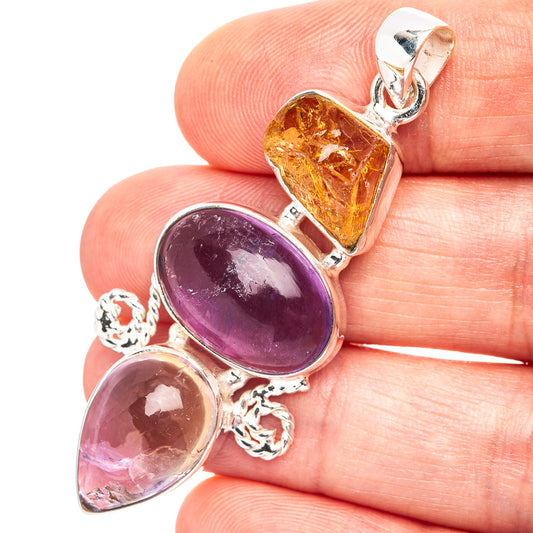 Sterling silver pendant with oval purple amethyst and oval orange citrine in bezels