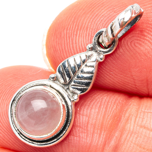 Rose quartz sterling silver pendant with round cabochon stone and leaf-like bail