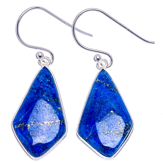 Silver fishhook earrings featuring lapis lazuli blue pear-shaped stones with speckled texture