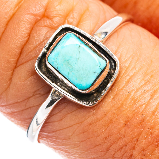 Sterling silver ring with rectangular turquoise gemstone in a square bezel setting