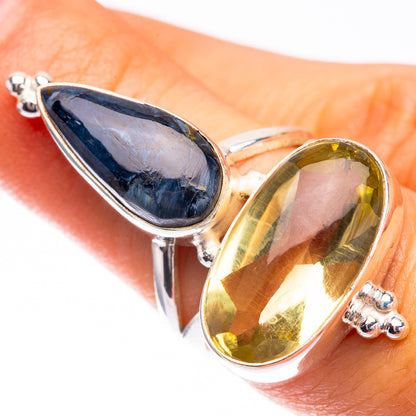 Two-stone silver ring with dark blue teardrop and yellow teardrop gemstones