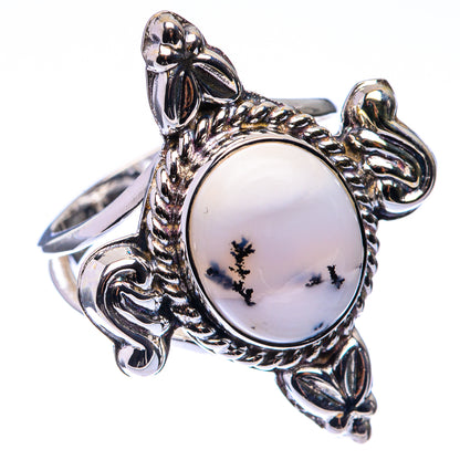 Sterling silver ring with oval opal cabochon and detailed leaf-like side settings