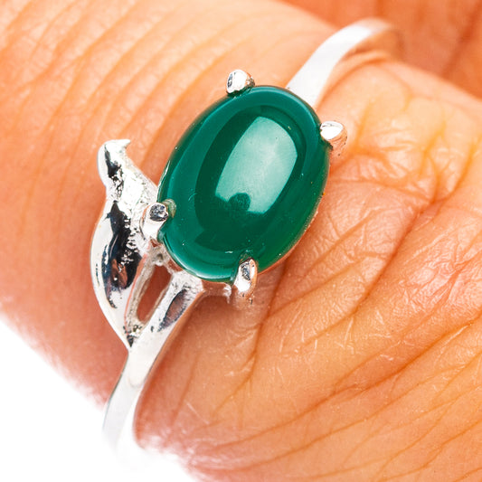 Sterling silver ring with green oval onyx and dainty bird motif at the band