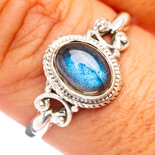 Sterling silver labradorite ring with oval stone, bezel set and decorative halo details