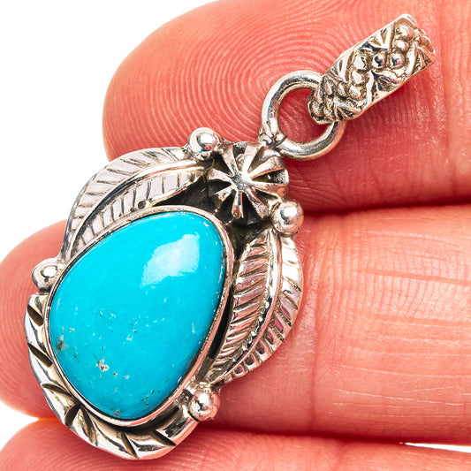 Turquoise oval pendant in .925 sterling silver with star and feather accents