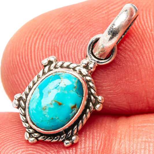 Sterling silver turquoise pendant with oval stone and ornate bezel, small bail loop