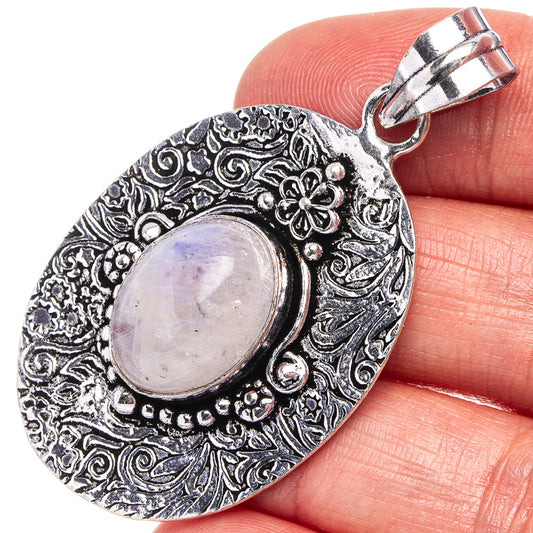 German silver moonstone pendant with oval pale lavender cabochon and ornate etched bezel