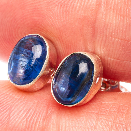 Oval blue kyanite cabochon stud earrings in .925 sterling silver bezel, close-up