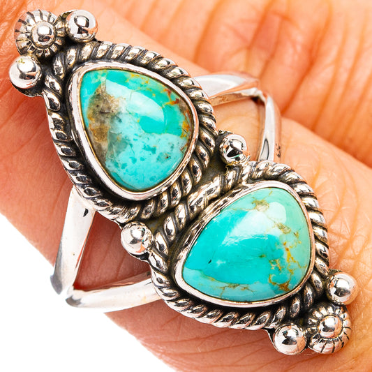 Sterling silver ring with two turquoise teardrop stones and ornate beadwork setting