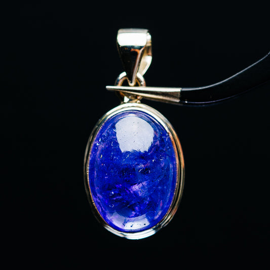 Sterling silver oval tanzanite pendant with raised bezel and top bail