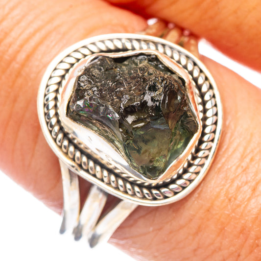 Sterling silver moldavite ring with oval green gemstone and beaded bezel