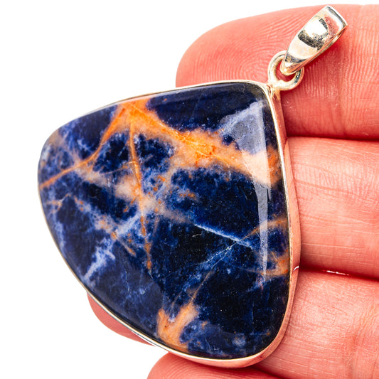 Teardrop sodalite pendant with polished sterling silver bail