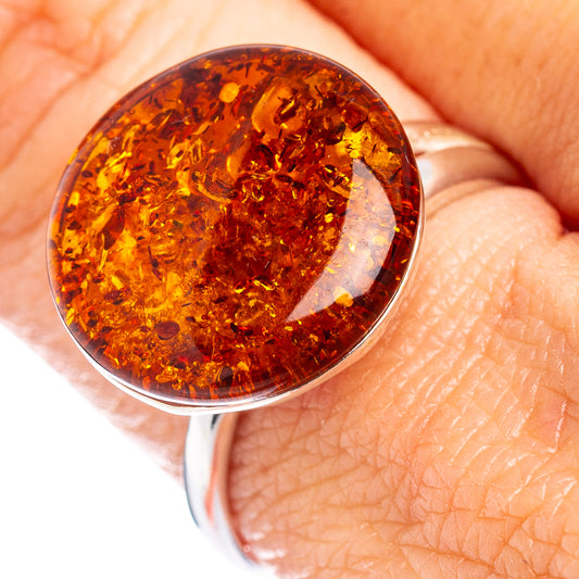 Baltic amber ring with round orange-brown stone in .925 sterling silver bezel