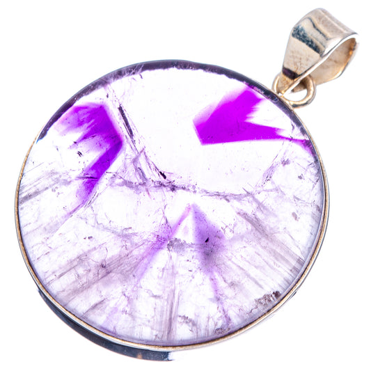 Round amethyst cabochon pendant, purple starburst pattern with silver bezel and bail