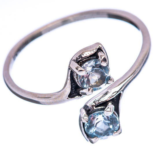 Sterling silver ring with bezel-set oval blue topaz and side prongs, size 6