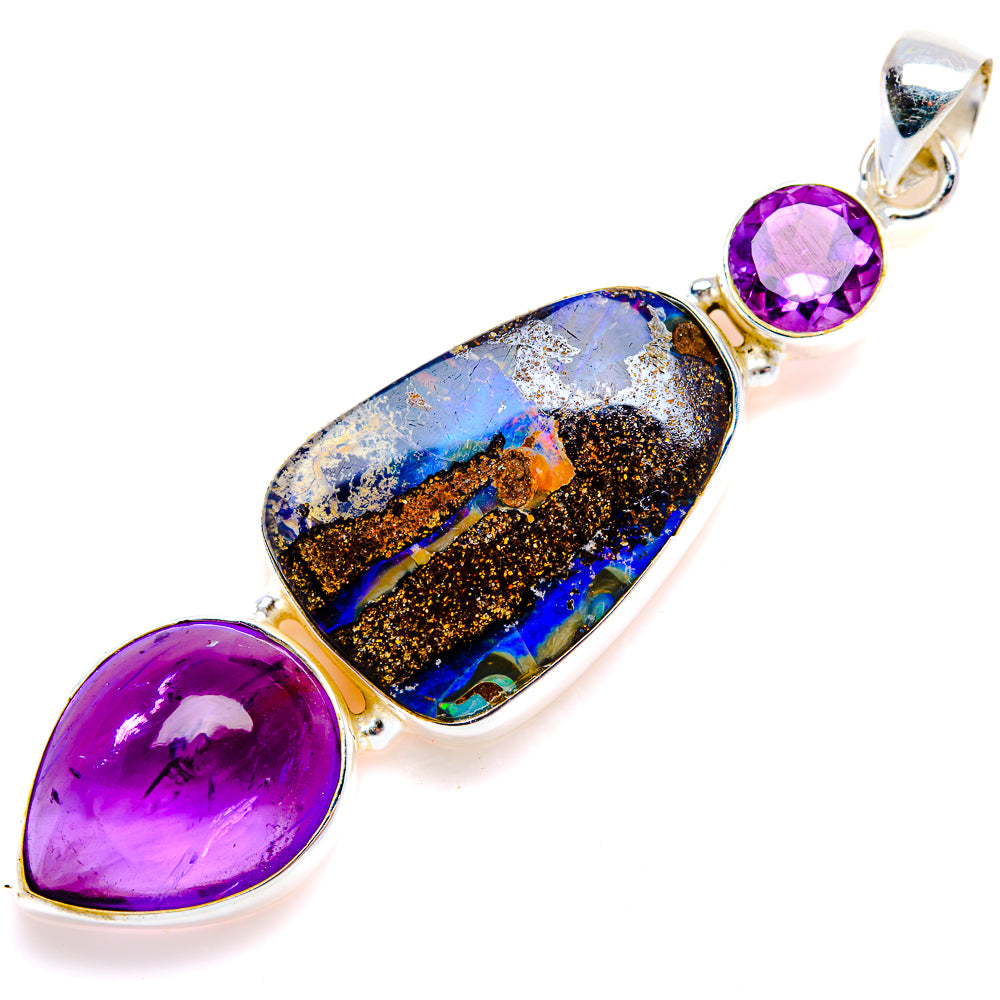 Sterling silver pendant featuring boulder opal and round purple amethyst center stone