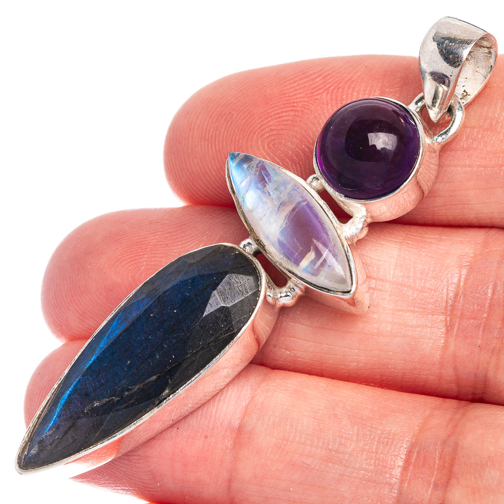 Three-stone sterling silver pendant with amethyst purple, labradorite blue, iridescent moonstone