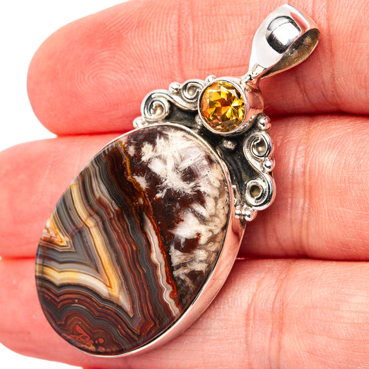 Sterling silver pendant with oval lace agate and round citrine gemstone, ornate setting