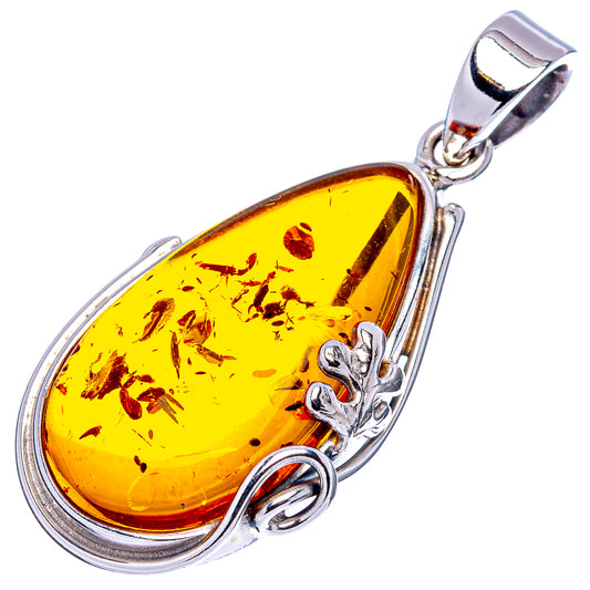 Yellow teardrop amber pendant, .925 sterling silver frame with clover detail