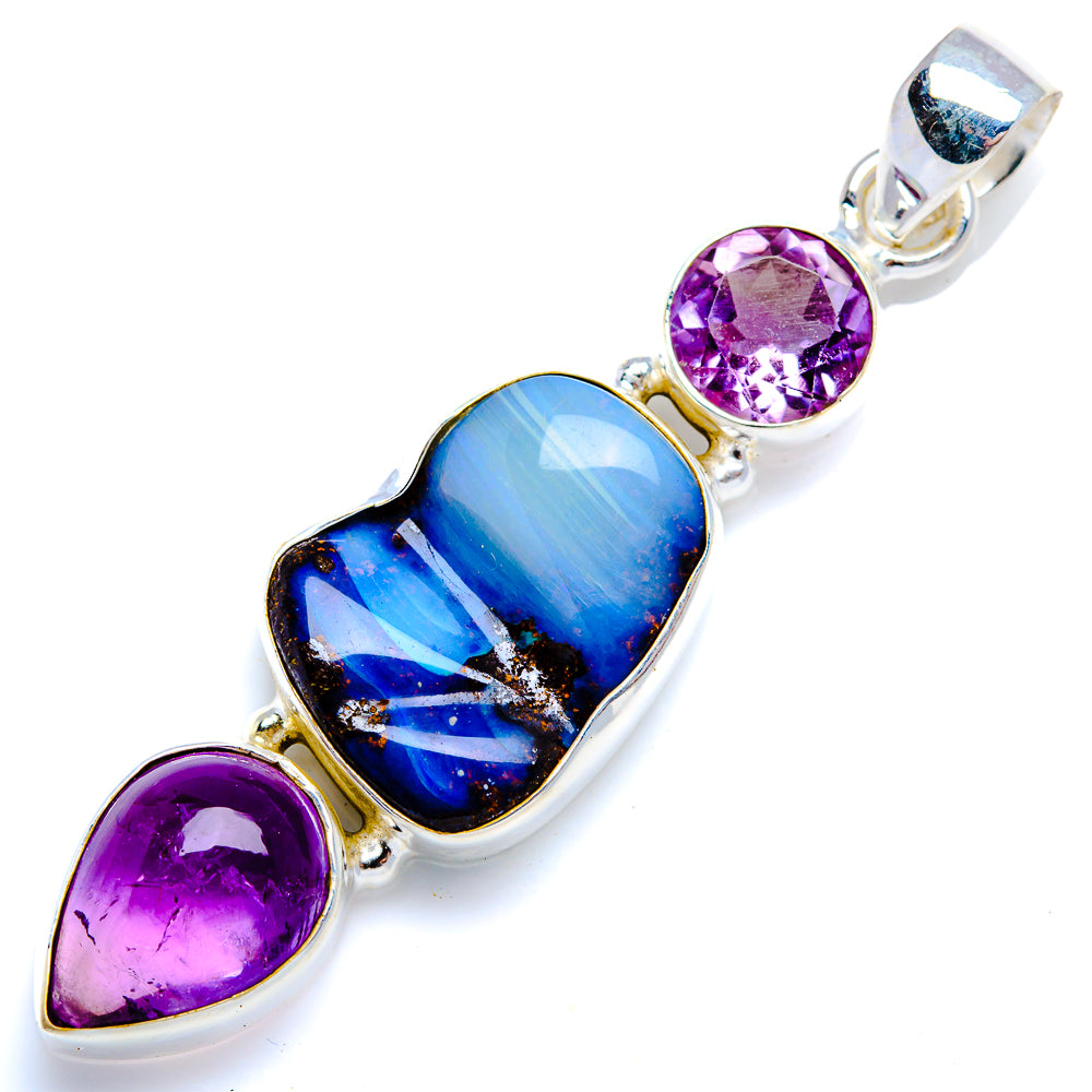 Sterling silver gemstone pendant with blue opal-style center and two amethyst accents