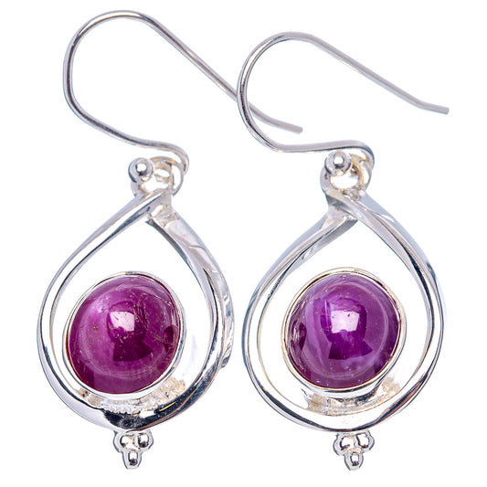Sterling silver teardrop drop earrings with round purple cabochon star ruby centers