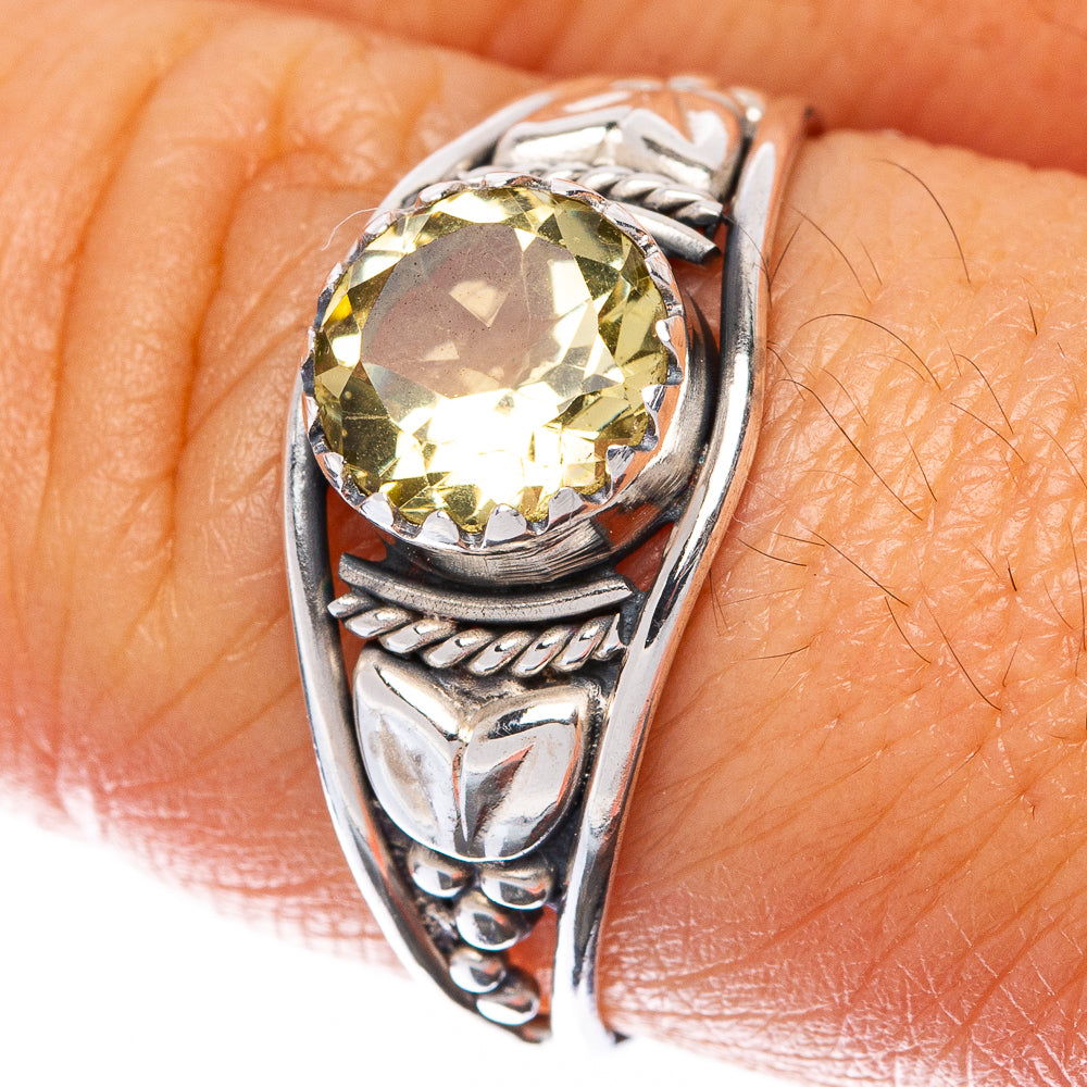Sterling silver ring with faceted citrine center stone and carved side details