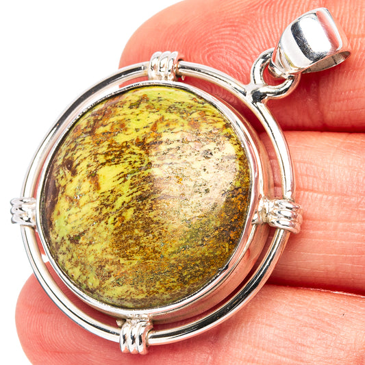 Round sterling silver gaspeite pendant with yellow-green mottled cabochon and bail