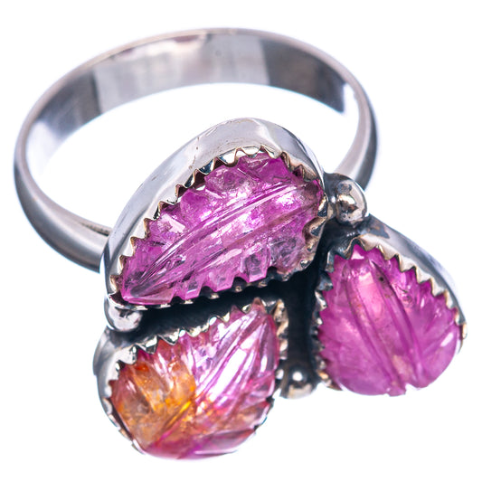 Silver ring featuring three carved purple gemstones with black prong details