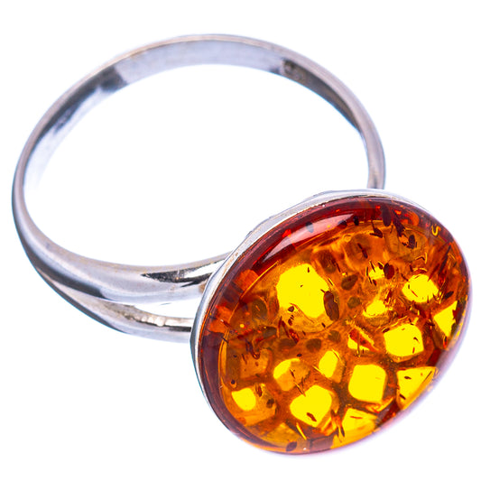 Amber cabochon ring with round yellow-orange stone on .925 sterling silver band