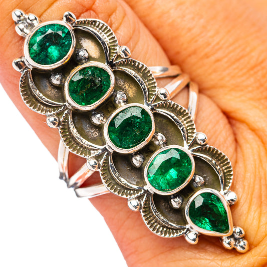 Oval green faceted emeralds in silver beaded settings, scalloped band ring