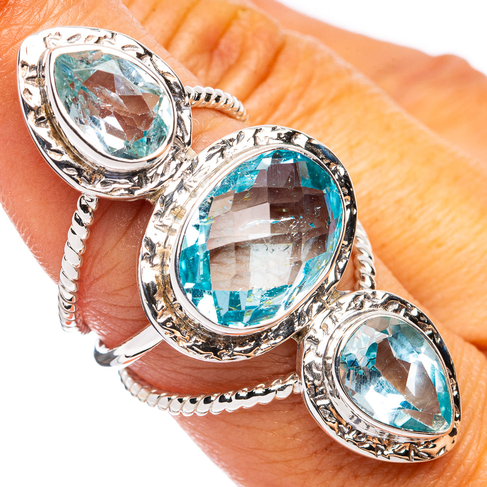 925 sterling silver ring with three oval blue topaz stones, split band