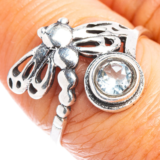 Sterling silver dragonfly ring with round light-blue gemstone halo