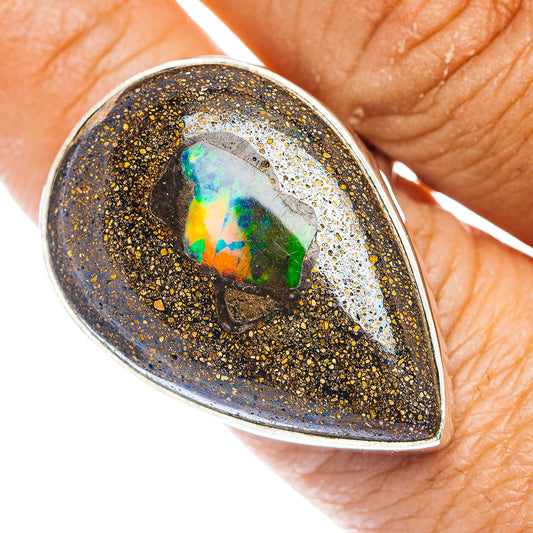 Oval boulder opal ring with blue-green flash in dark matrix, .925 silver setting