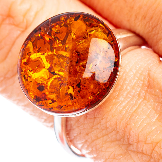Round amber cabochon ring with .925 silver band, warm honey-brown translucent stone