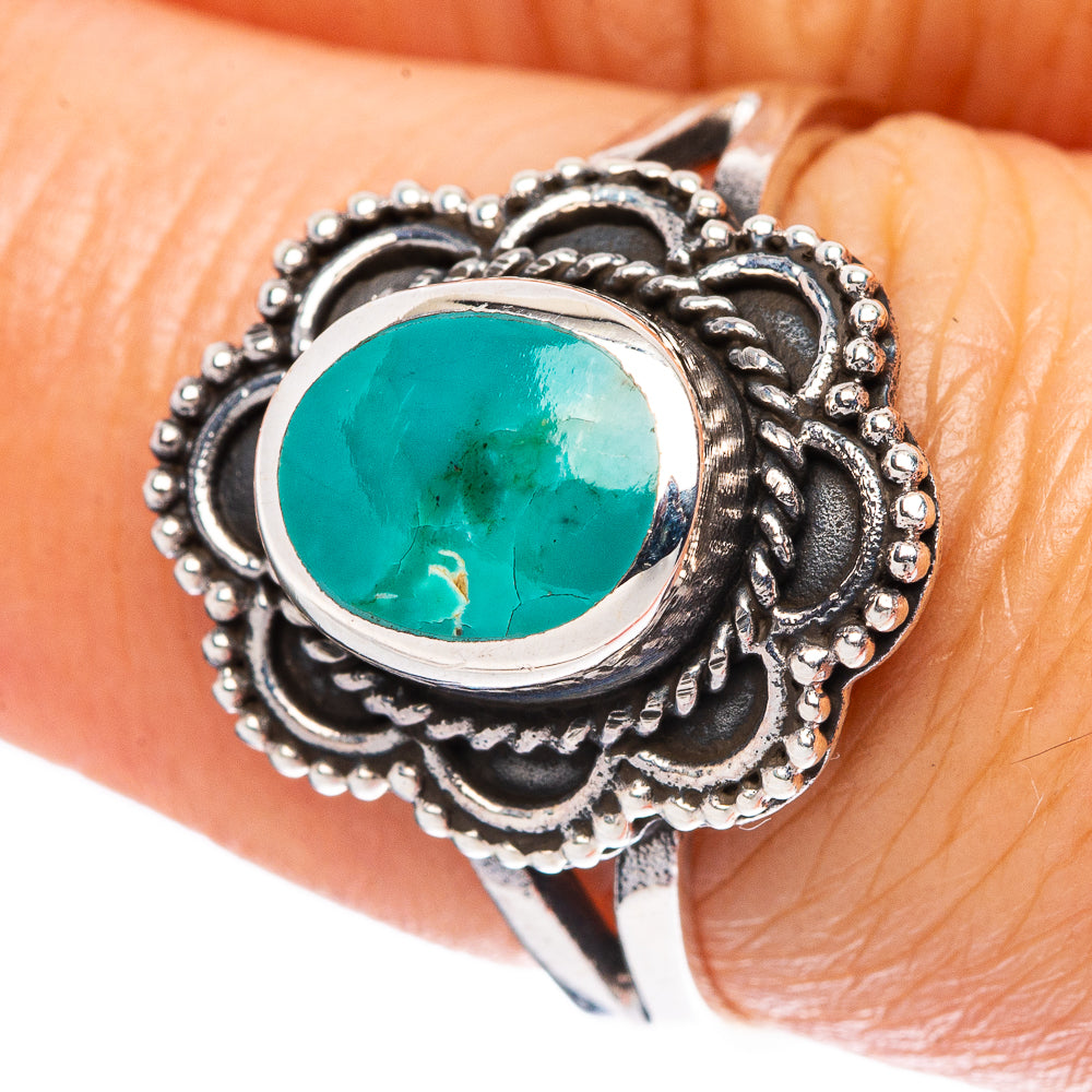 Oval turquoise cabochon silver ring with ornate scalloped filigree border