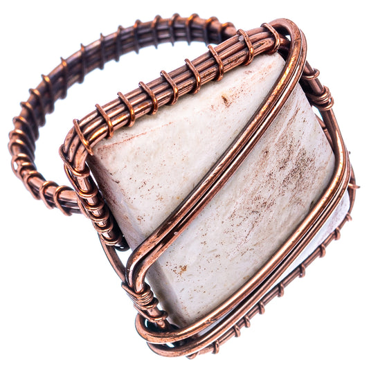 Oxidized copper wire-wrapped ring with rectangular off-white tube agate centerpiece