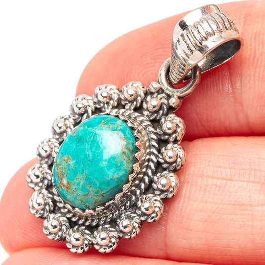 Turquoise oval stone pendant with detailed sterling silver rope border and bail