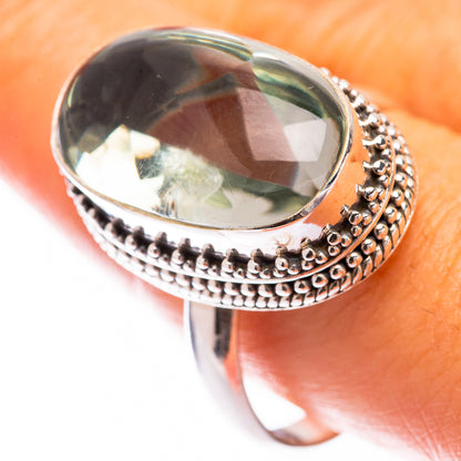 Sterling silver ring with oval faceted green amethyst and beaded halo edge