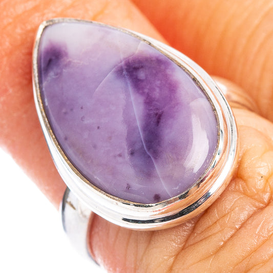 Sterling silver ring with purple teardrop cabochon gemstone, close-up on stone