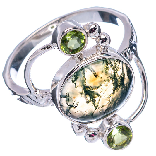 Sterling silver statement ring with oval green moss agate center and three green gemstones