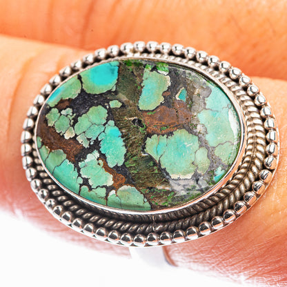 Turquoise oval gemstone ring with silver beaded bezel and detailed band